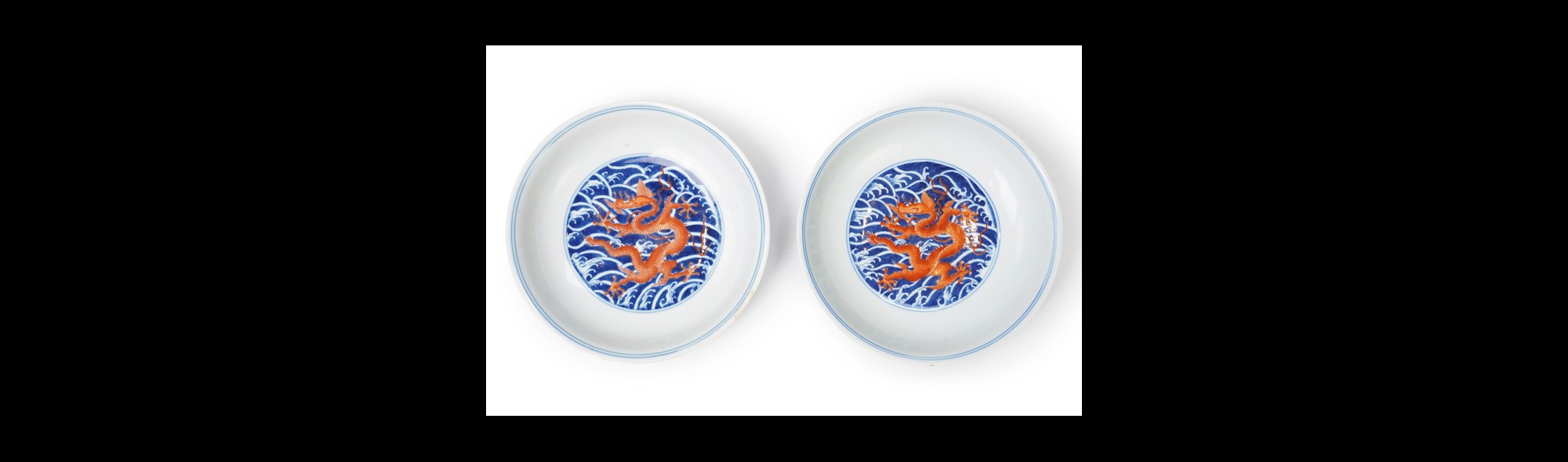 A pair of Chinese iron red and underglaze blue ‘dragon’ dishes, Qianlong seal mark and of the period (1736-95)