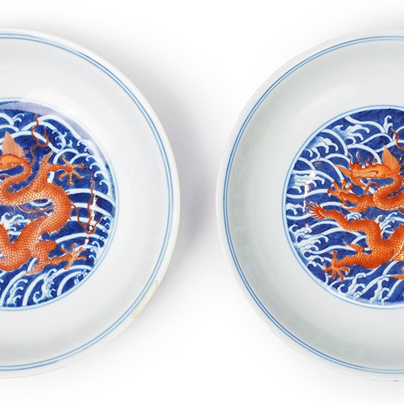 A pair of Chinese iron red and underglaze blue ‘dragon’ dishes, Qianlong seal mark and of the period (1736-95)