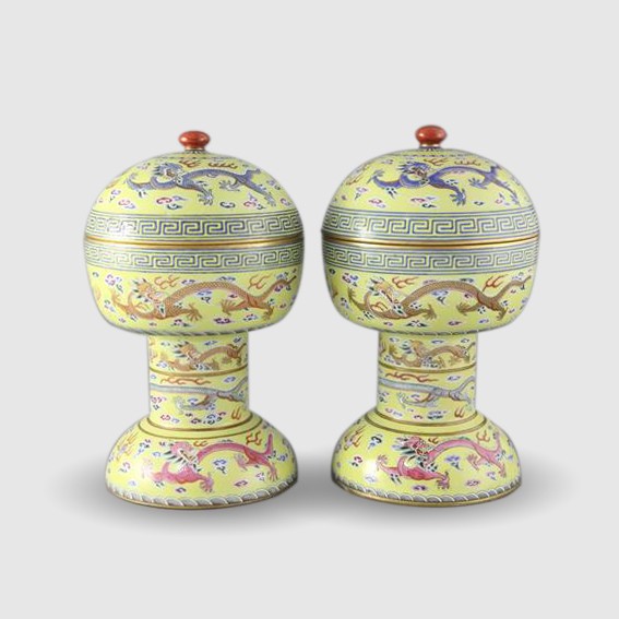 A pair of Chinese yellow ground altar vessels and covers