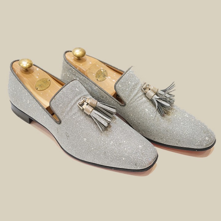 A pair of gentleman's Christian Louboutin silver glitter tasselled loafers