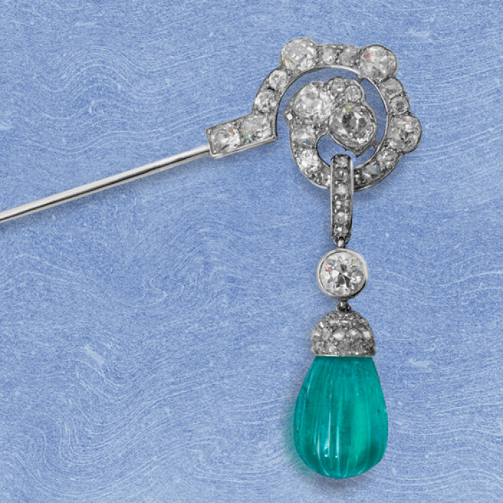 A fine Art Deco carved emerald and diamond jabot pin, circa 1925