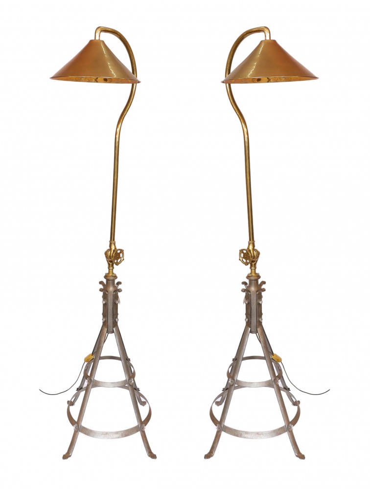 A pair of industrial-style brass and wrought iron adjustable lamp standards