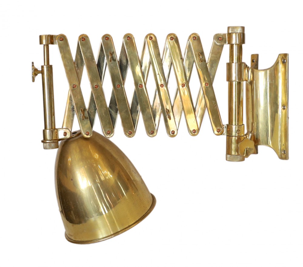 An early 20th-century style black and brass expanding wall light