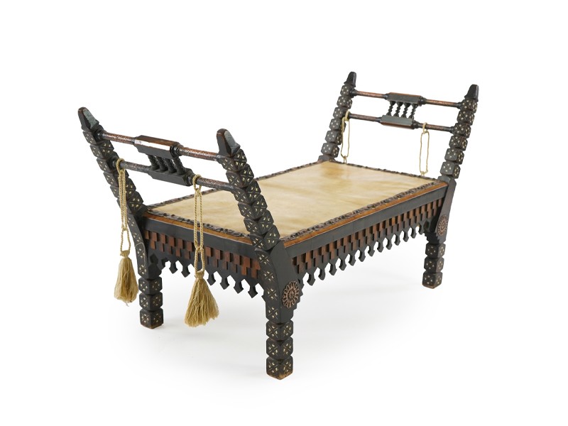 Carlo Bugatti (Italian, 1856-1940) A window seat or bench Carlo Bugatti (Italian, 1856-1940) A window seat or bench