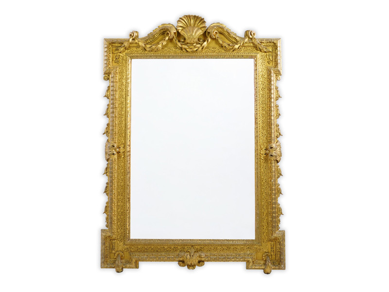 A late 19th century French carved gilt wood and composition overmantel mirror