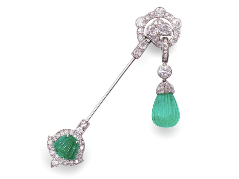 A fine Art Deco carved emerald and diamond jabot pin, circa 1925