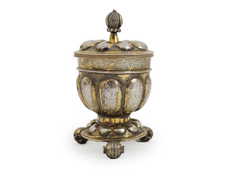 A 16th/17th century German silver gilt 'pineapple' cup and cover A 16th/17th century German silver gilt 'pineapple' cup and cover